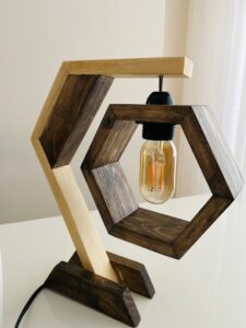 Rustic wooden table lamp with Edison bulb on modern desk 