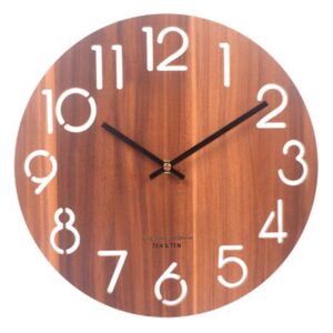 Rustic 13-inch wooden wall clock on white wall above bed in modern room

